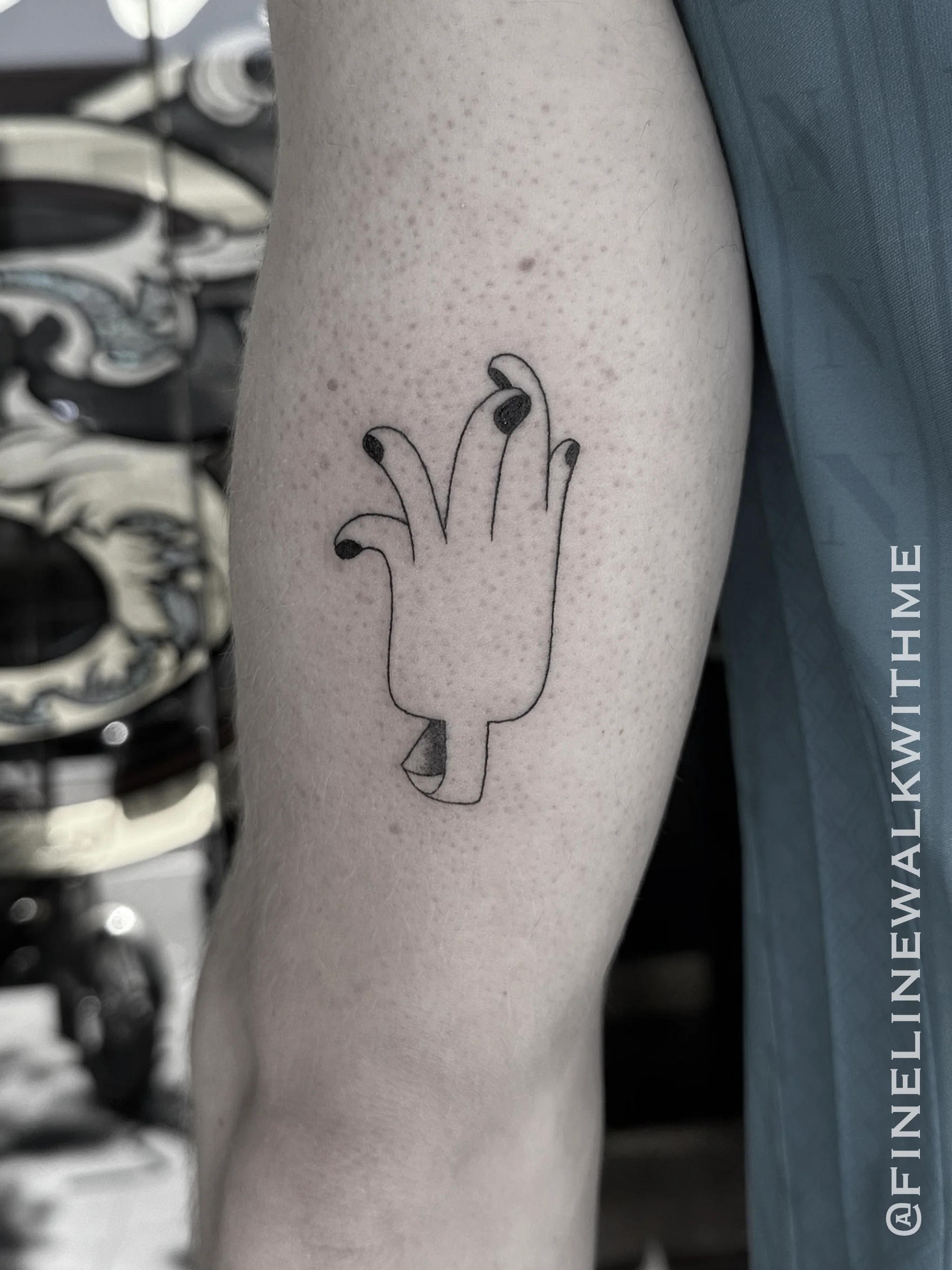 Minimal fine line hand tattoo by Sydney tattoo artist